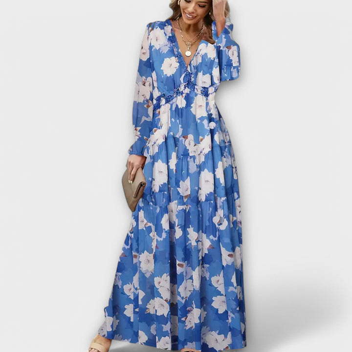 Chic women's tiered maxi dress featuring vibrant floral print, ideal for race day fashion.