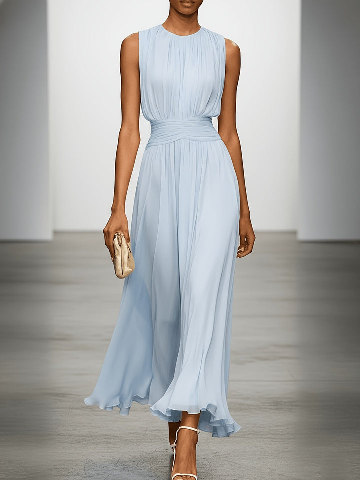 Stylish pleated maxi dress for women, ideal for wedding guests, garden parties, or races. Ruched waist detail.