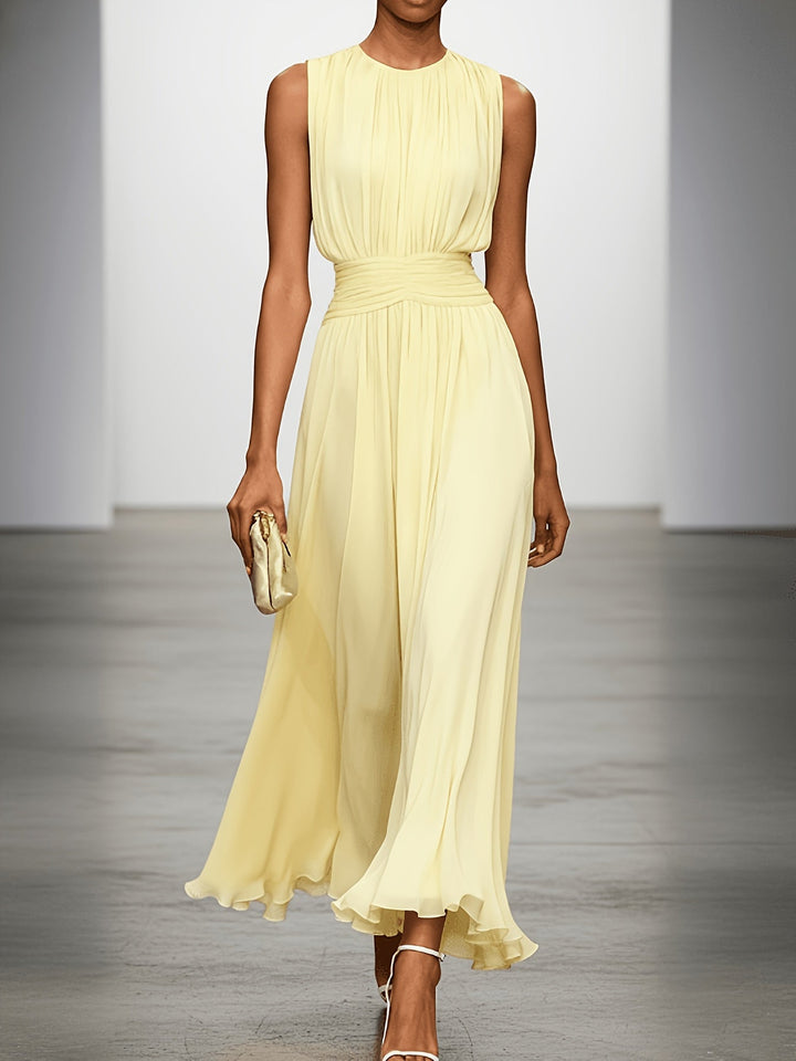 Beautiful sleeveless pleated maxi dress for women, featuring a flattering ruched waist. Great for various occasions.