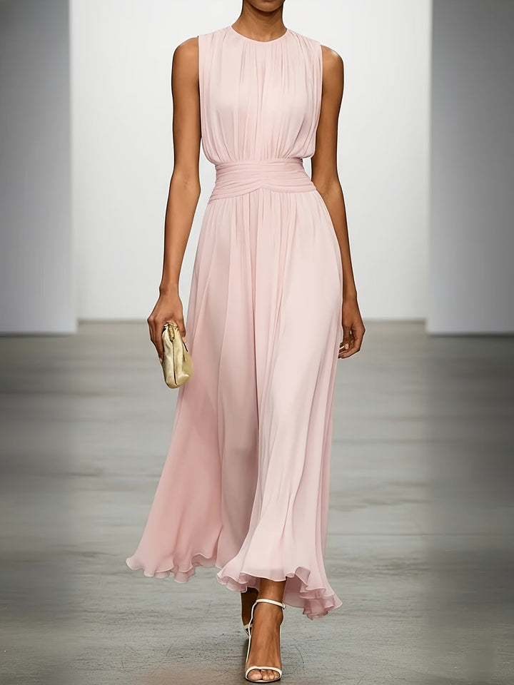Long pleated maxi dress for women with an elegant silhouette & a flattering ruched waist. Ideal formal wear.