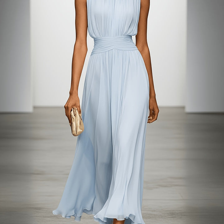 Stunning women's pleated maxi dress, a perfect wedding guest dress or formal summer party outfit with ruched detail.