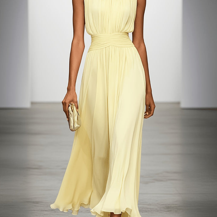 Chic women's sleeveless maxi dress, featuring delicate pleats & a ruched waist. An elegant choice for any special occasion.