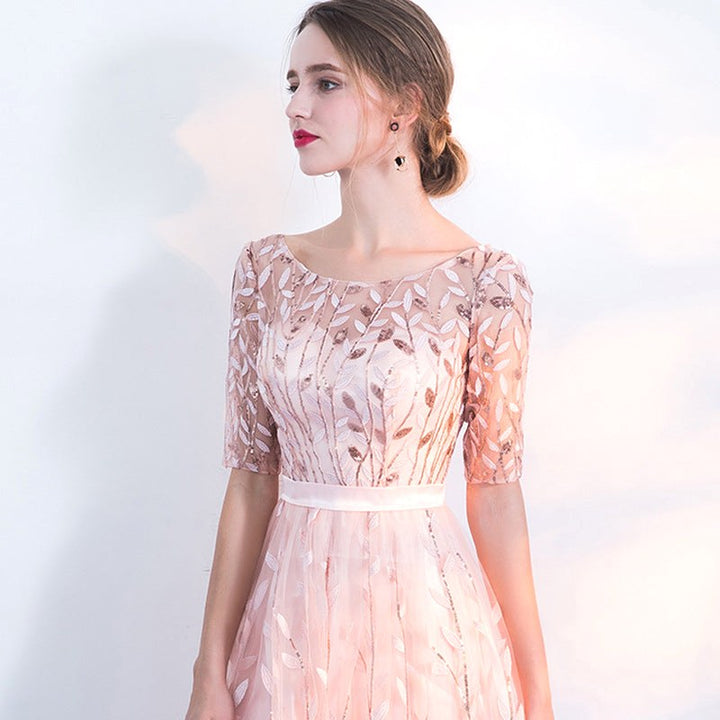 Comfortable pink flowy midi dress with half-sleeves & a crew neck, great for women's casual autumn wear.