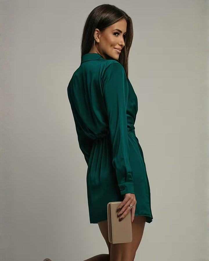 Elegant women's wrap collared mini cocktail dress, long sleeves, flattering for evening & party wear.