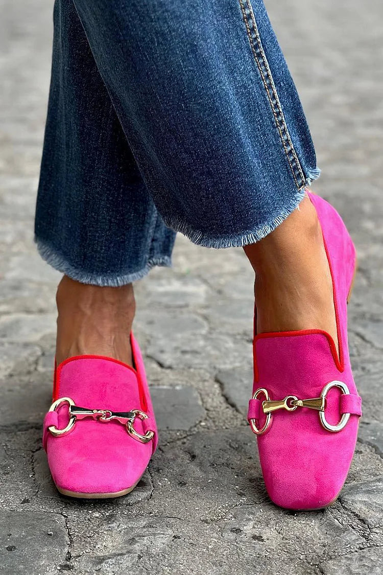 Bold women's fluorescent pink metallic slip-on loafers, a statement fashion footwear piece with contemporary style.