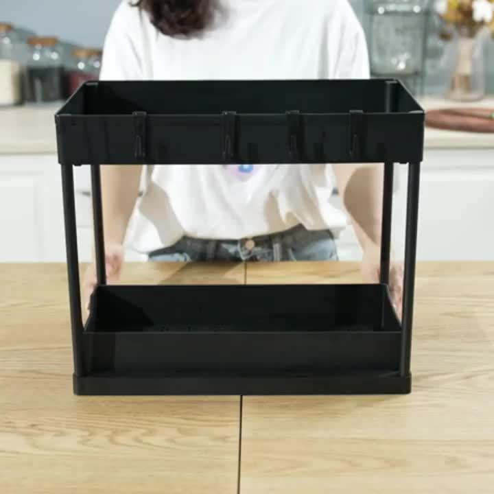 Two-tier under sink organizer with pull-out drawers, hooks & cup for efficient kitchen and bathroom storage.