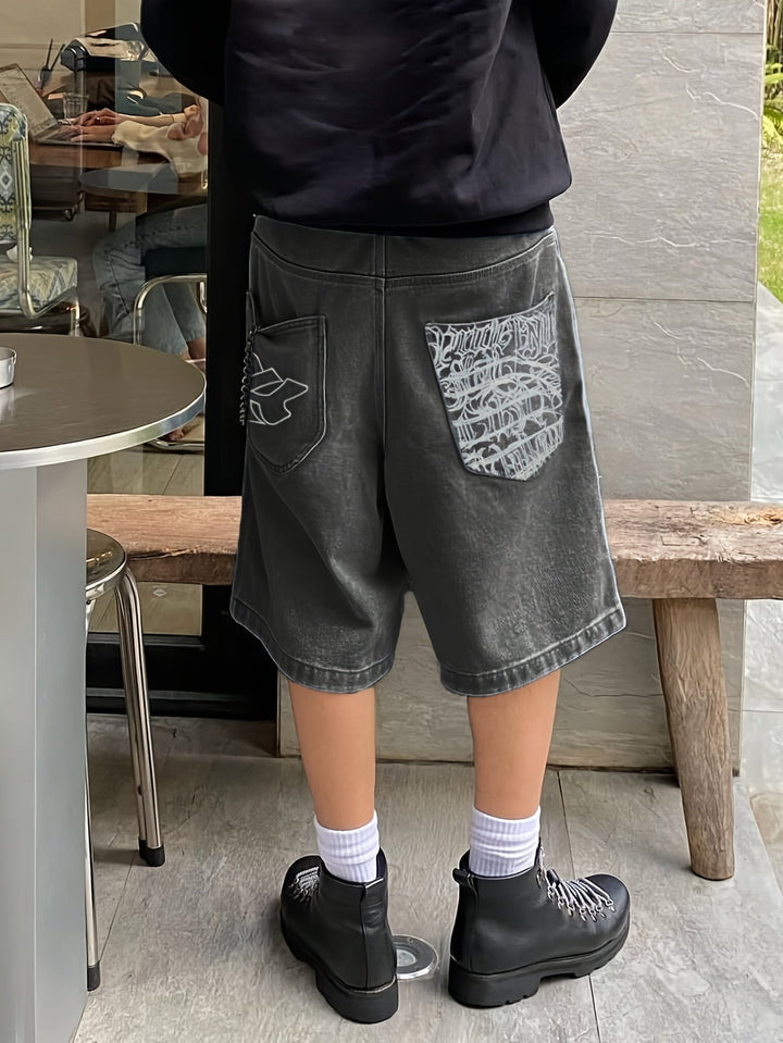 Streetwear-inspired men's loose fit denim shorts with elegant floral embroidery design.