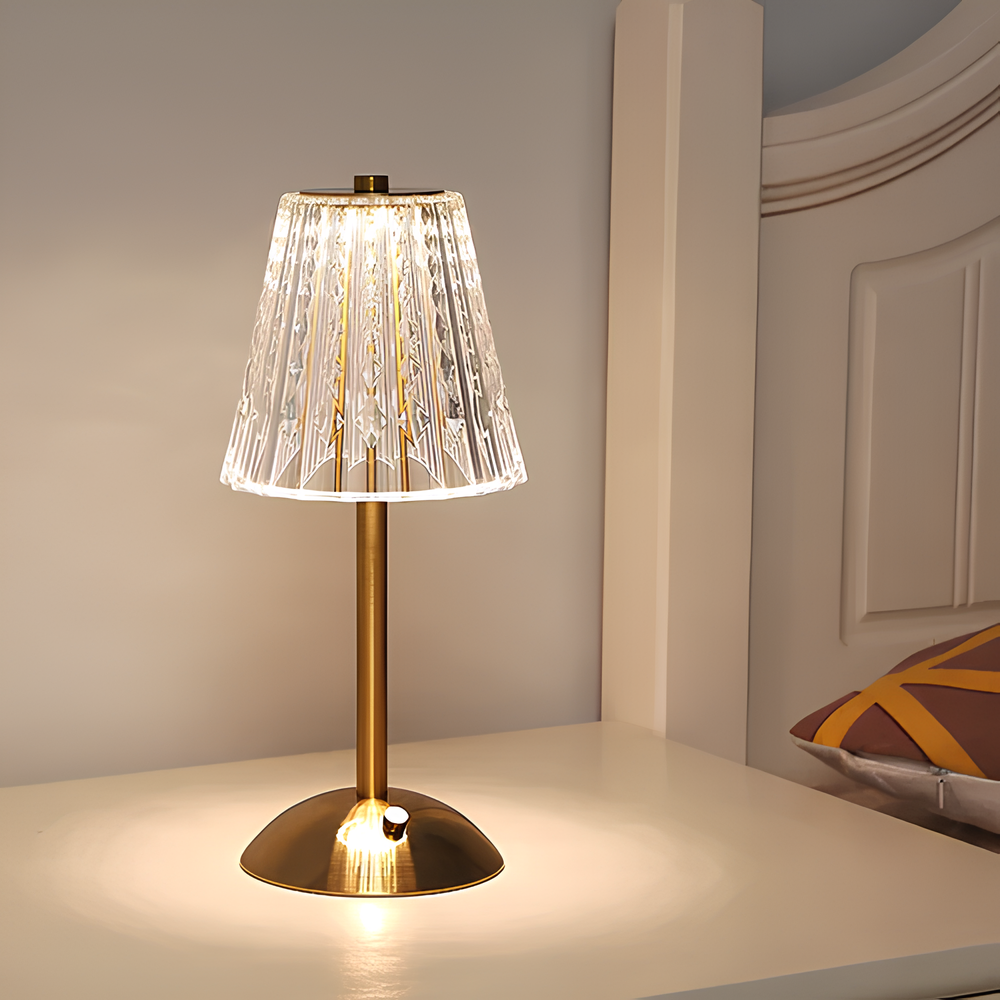 A golden-finished crystal LED table lamp, dimmable, cordless, and easily controlled by touch.