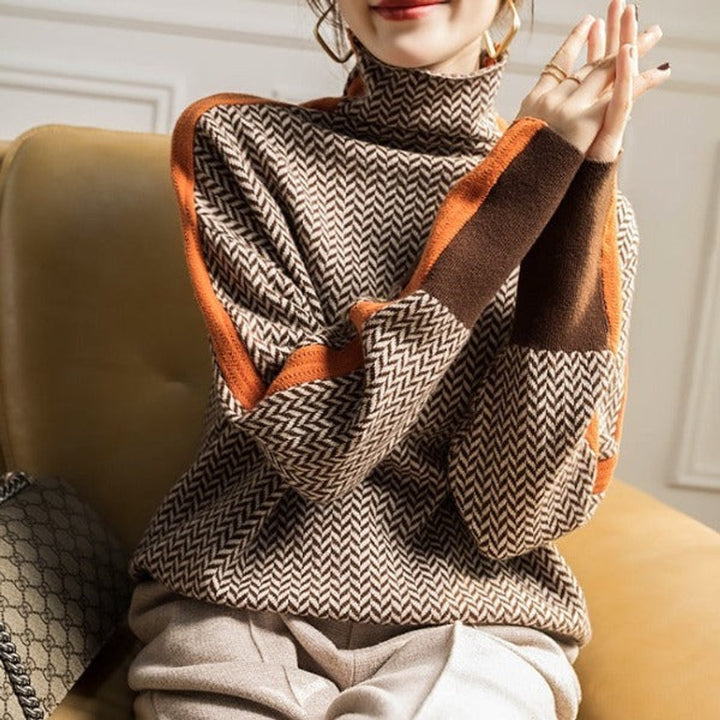 Women's oversized houndstooth knit turtleneck. A chic, cozy long-sleeve sweater, ideal for winter fashion.