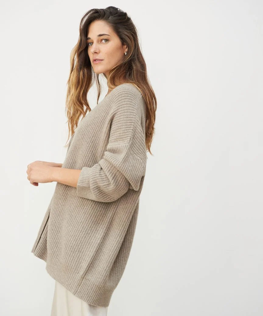 Stylish women's cardigan sweater. Elegant & versatile for fashion layering. Cozy outerwear.