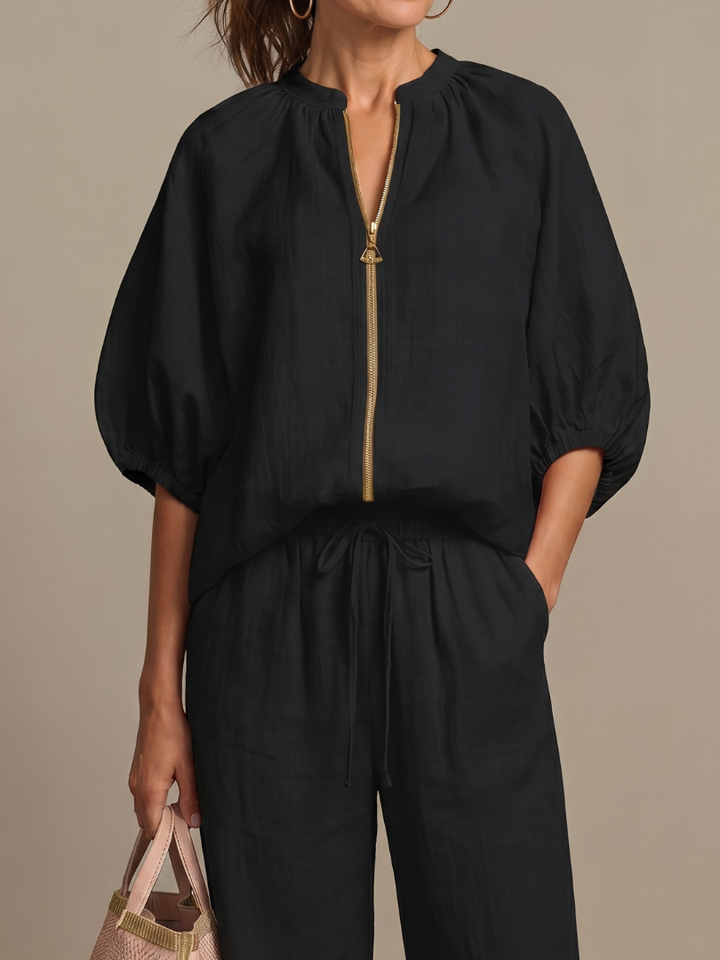 Everyday elegant women's two-piece set with blouson top and wide-leg pants.