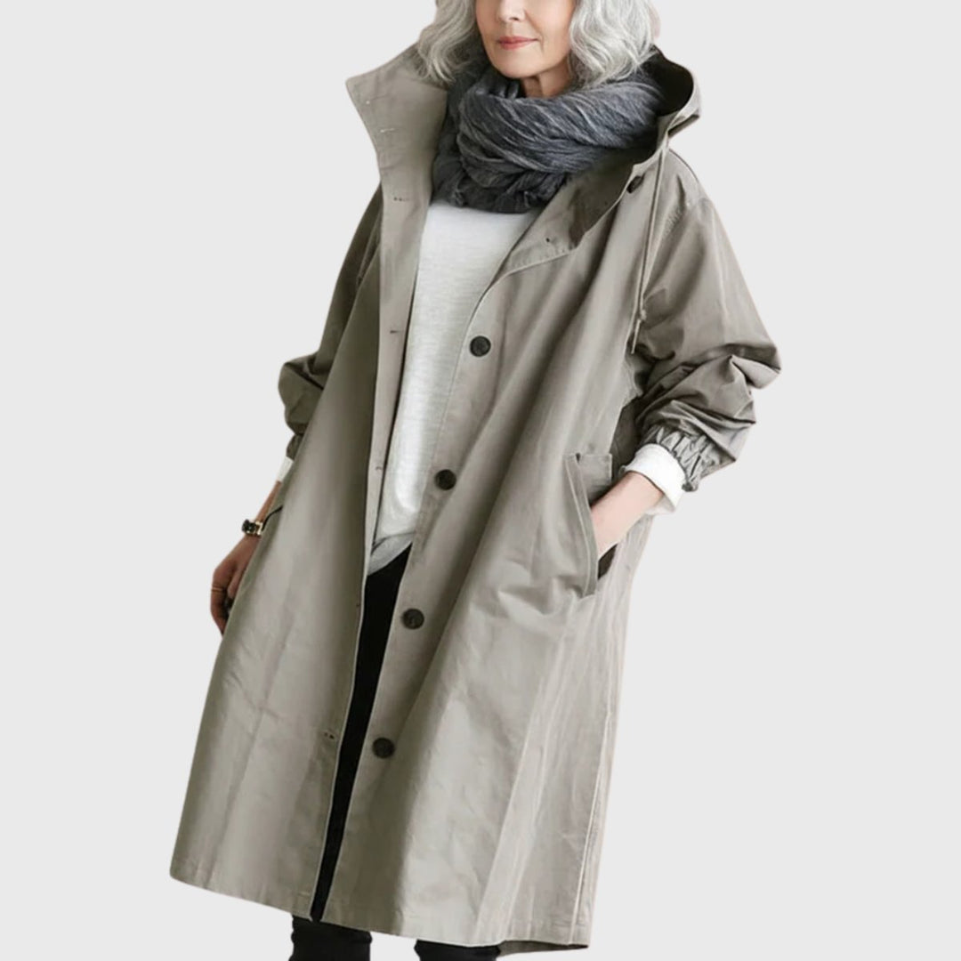 Women's long water-resistant hooded trench coat, ideal for fall & spring weather protection & travel.