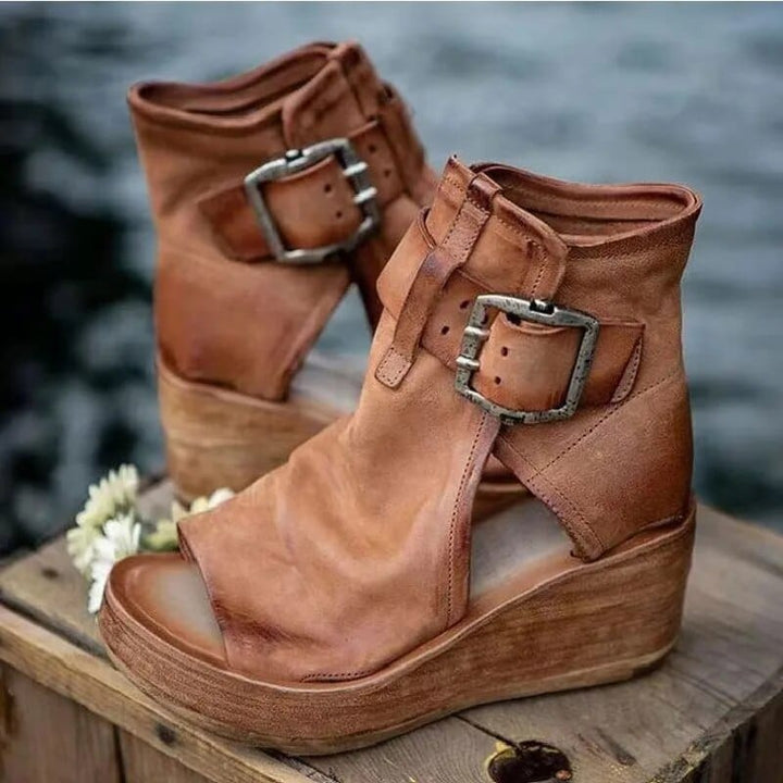 Women's distressed open-toe wedge sandals with stylish buckles, perfect for summer fashion.