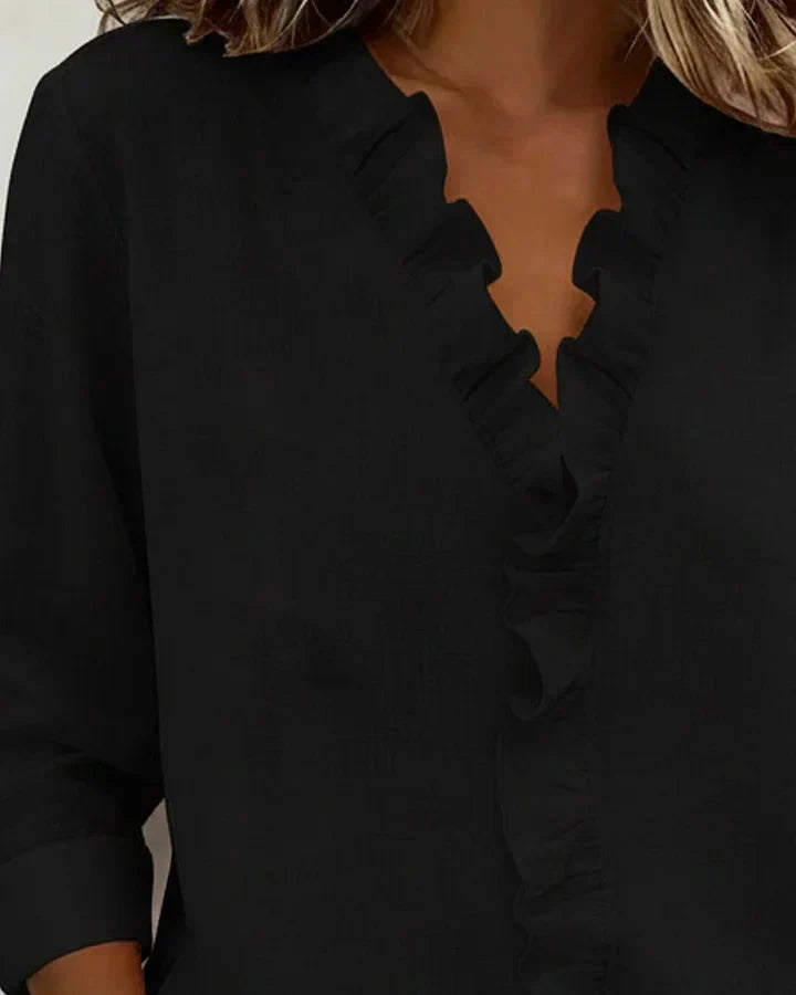 Elegant women's lightweight V-neck blouse with gentle ruffles, offering a comfortable, sophisticated look.