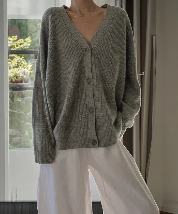Full length view of the elegant beige knit cardigan vest, versatile for any season.