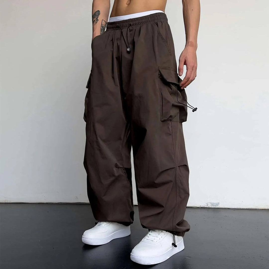 Full-length view of black relaxed fit cargo joggers, a blend of comfort, style, and utility.