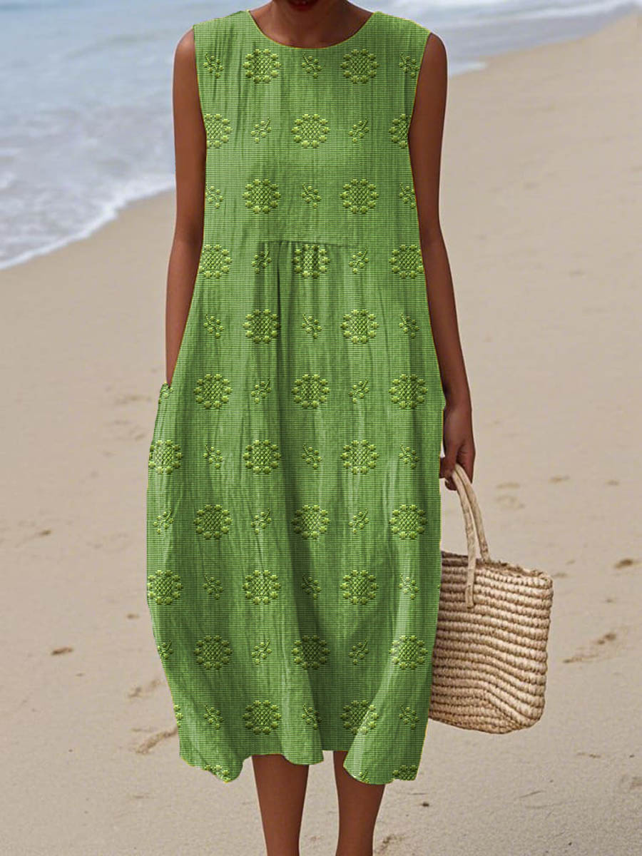 Elegant women's summer midi dress with delicate embroidery and practical pockets, perfect for casual or vacation wear.