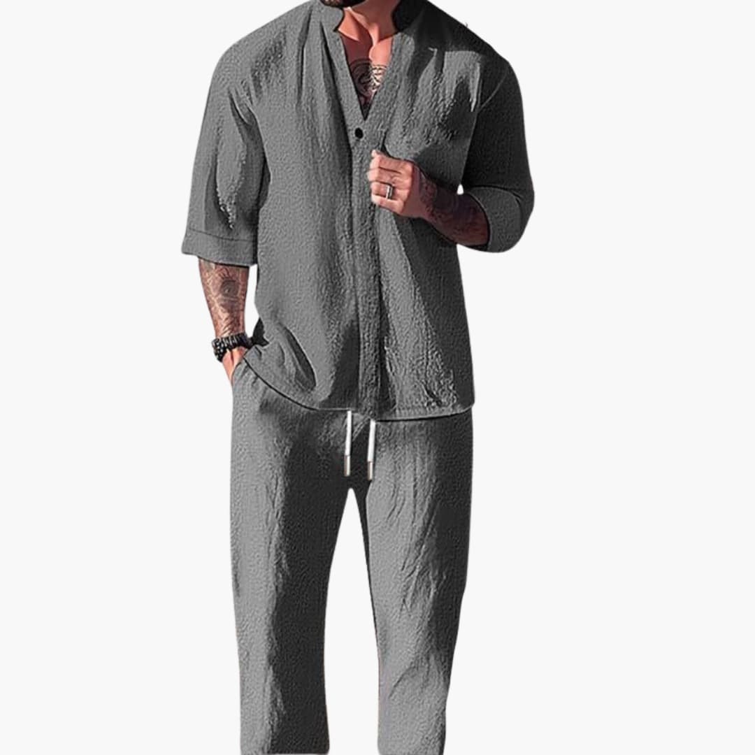 Men's relaxed fit grey two-piece set with V-neck shirt & drawstring pants for casual summer wear.