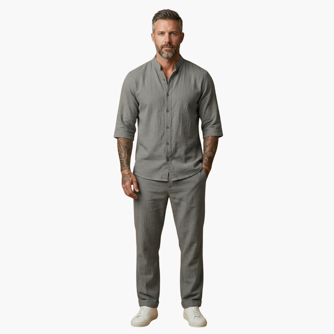 Comfortable men's white two-piece shirt and drawstring pants set, versatile for relaxed summer outfits.