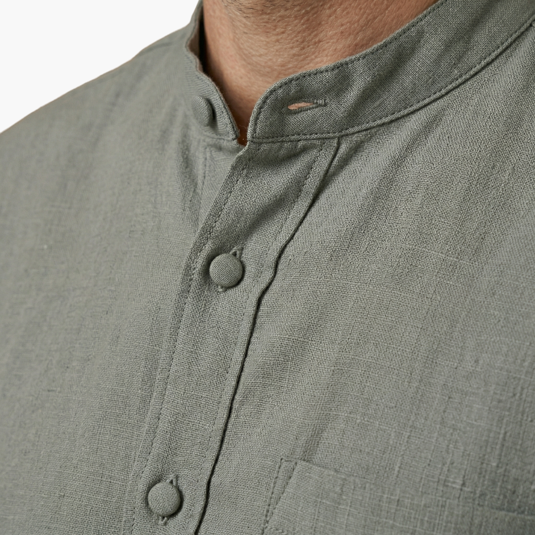 Men's relaxed V-neck shirt in white, part of a two-piece set with matching drawstring pants for summer.