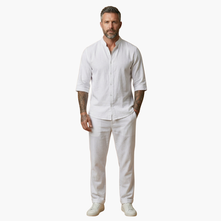 Men's relaxed summer outfit: a grey two-piece set featuring a V-neck shirt and comfortable drawstring pants.