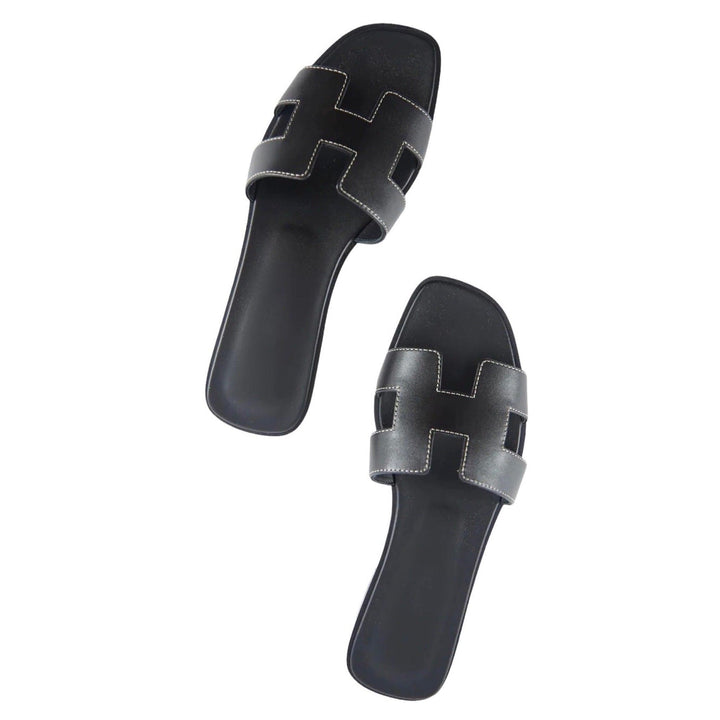 Comfort footwear: women's elegant open-toe slippers. Perfect for luxurious summer travel.