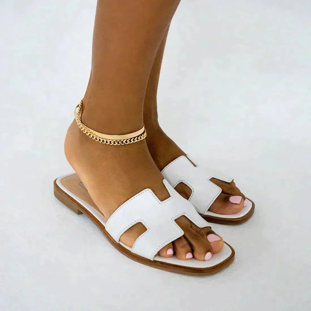 Women's elegant open-toe slippers, ideal for summer comfort at home or during travel.