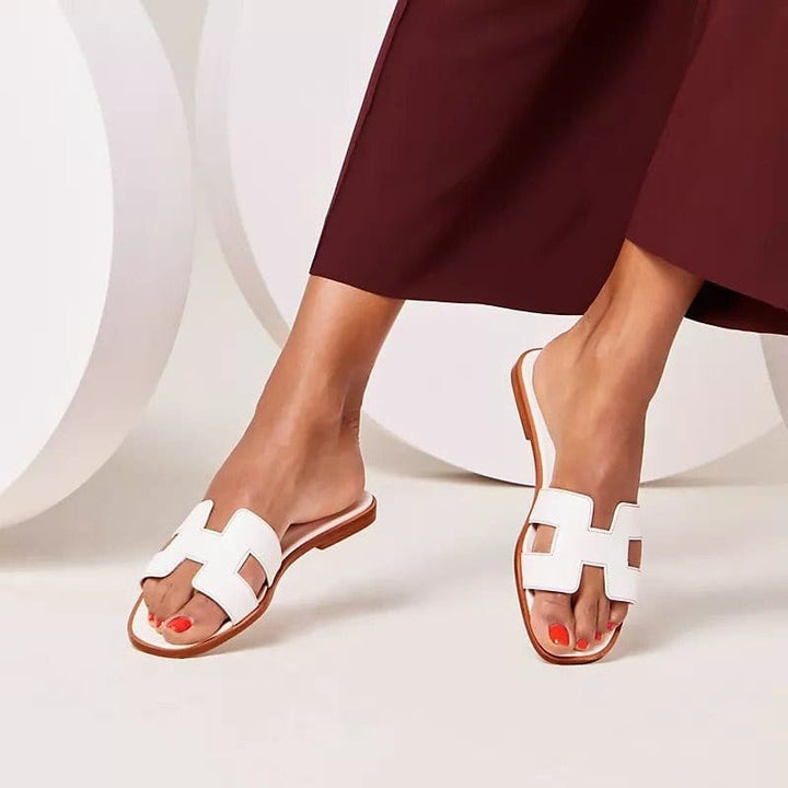 Elegant women's comfort slippers for luxurious home & travel. Summer open-toe slip-ons.