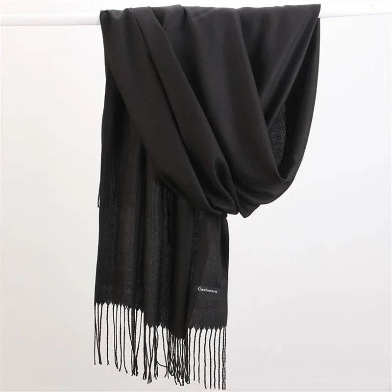 Luxurious women's cashmere scarf, soft knit, elegant winter fashion accessory.