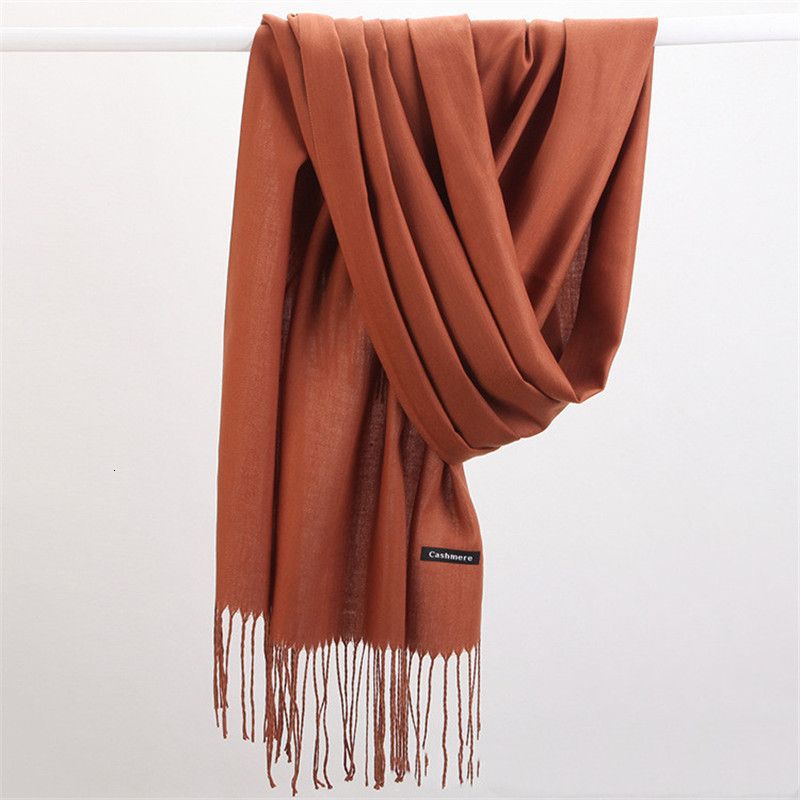 Elegant solid cashmere scarf, a stylish accessory for women's winter fashion.