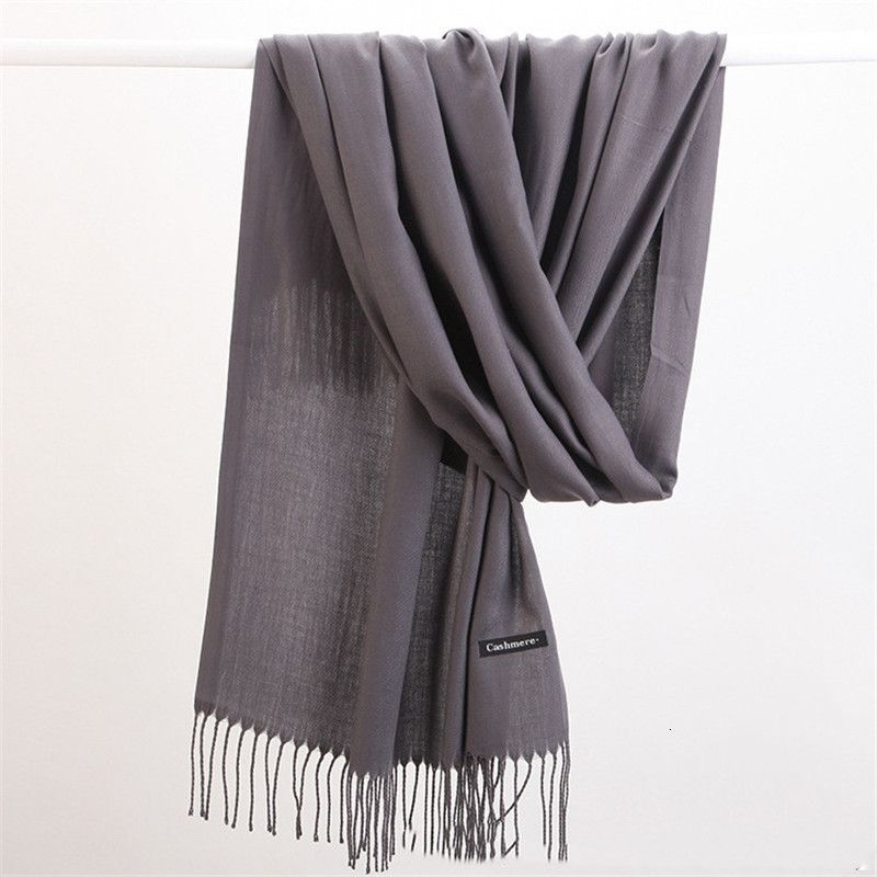 Indulgent cashmere scarf, soft knit luxury wrap, essential for elegant winter style.