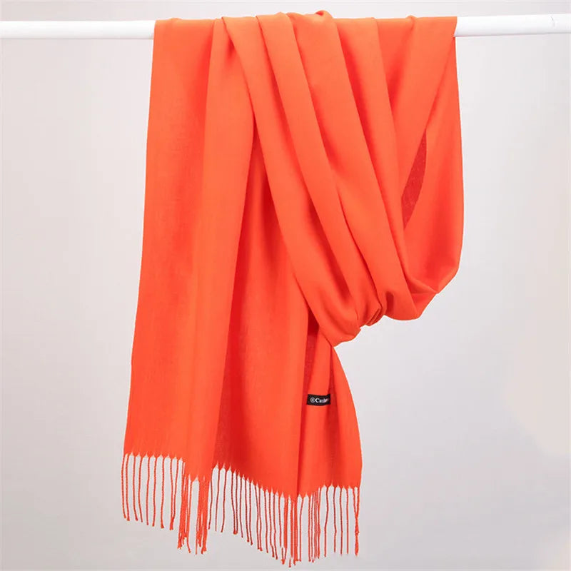 Solid color cashmere scarf, close-up of soft knit texture, elegant women's accessory.