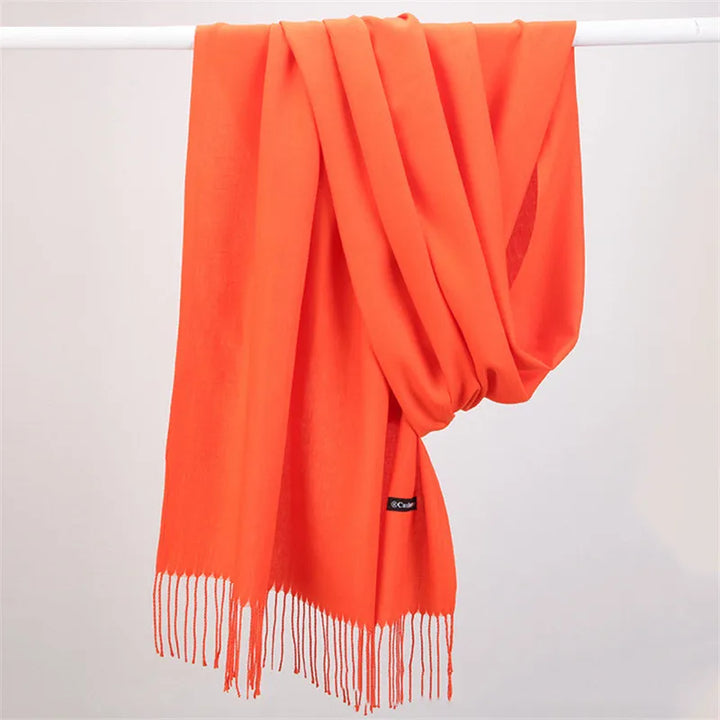 Solid color cashmere scarf, close-up of soft knit texture, elegant women's accessory.
