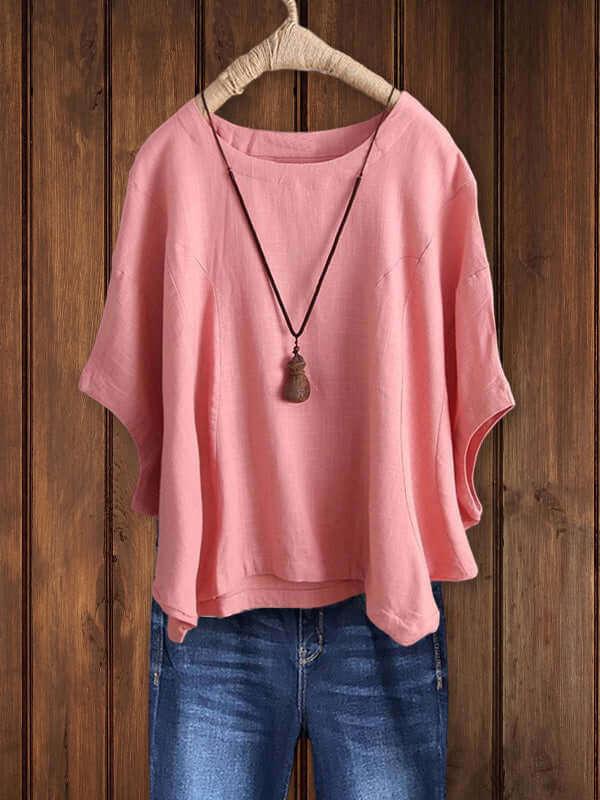 Effortless women's casual tunic top with dolman sleeves & crew neck. Relaxed fit for comfortable everyday style.