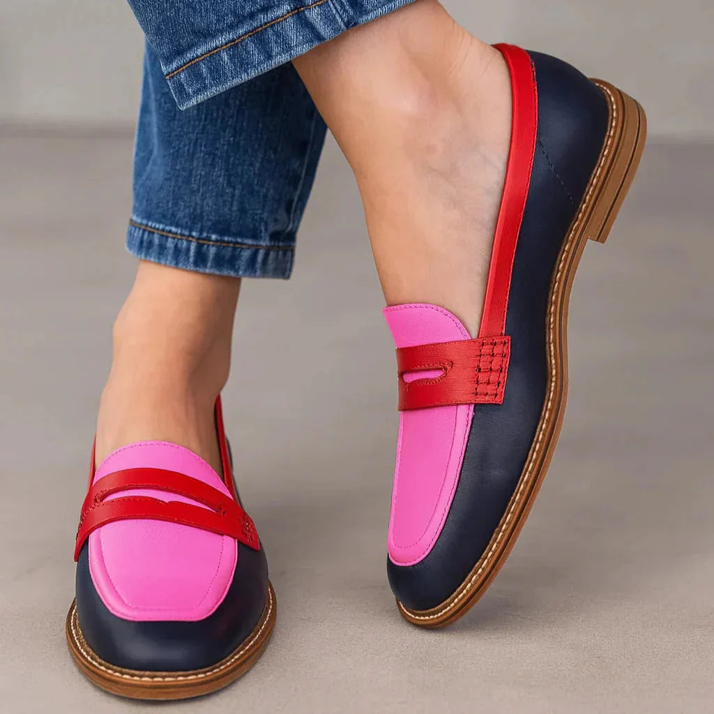 Chic women's two-tone penny loafers for elegant, versatile style. Perfect comfortable flats for office or casual wear.