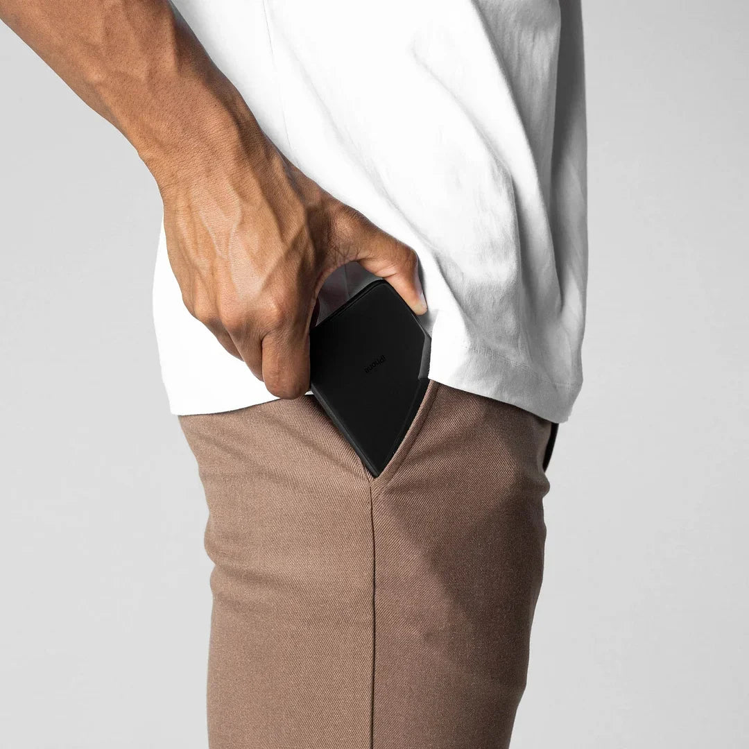 Black versatile chino pants, a staple for any men's fashion wardrobe.
