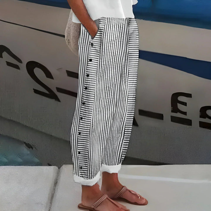 Comfortable women's lightweight striped pants with elastic waist & buttons, ideal for travel or versatile casual wear.
