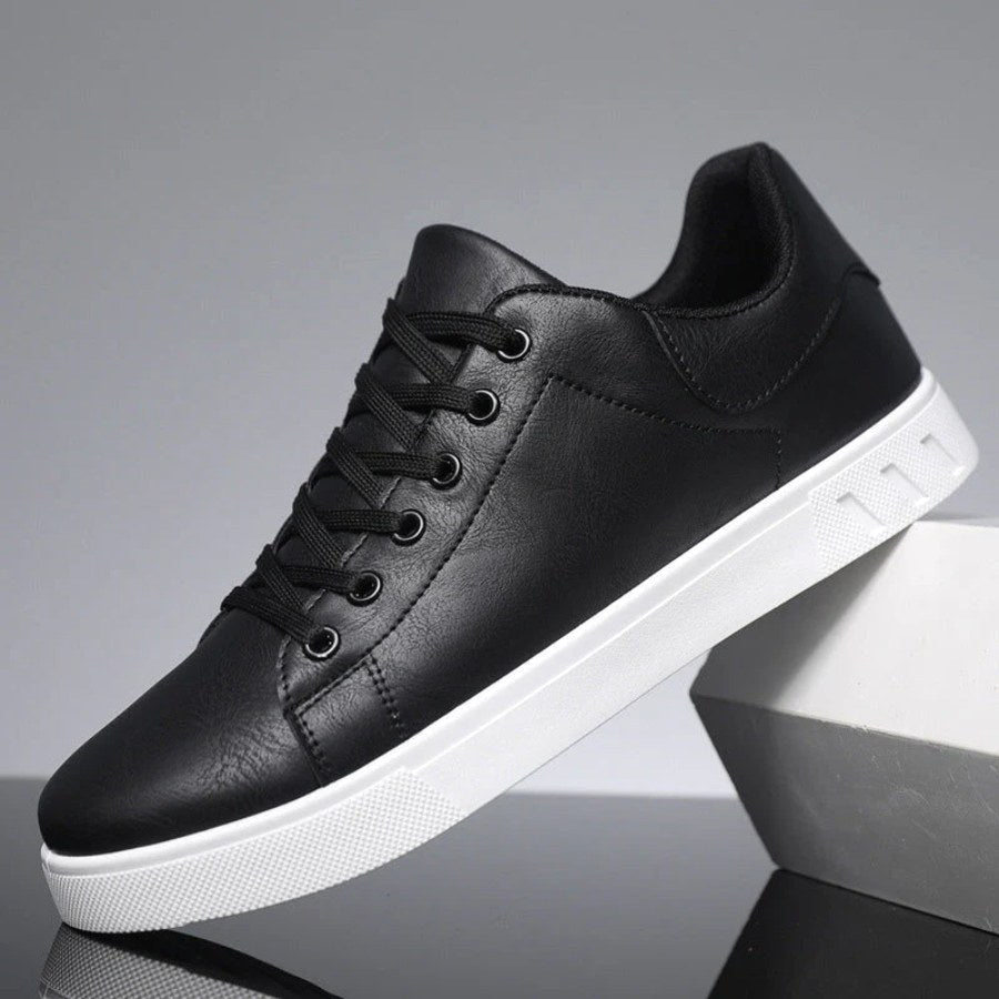 Black smart casual men's trainers, offering versatile style and everyday comfort for modern fashion.