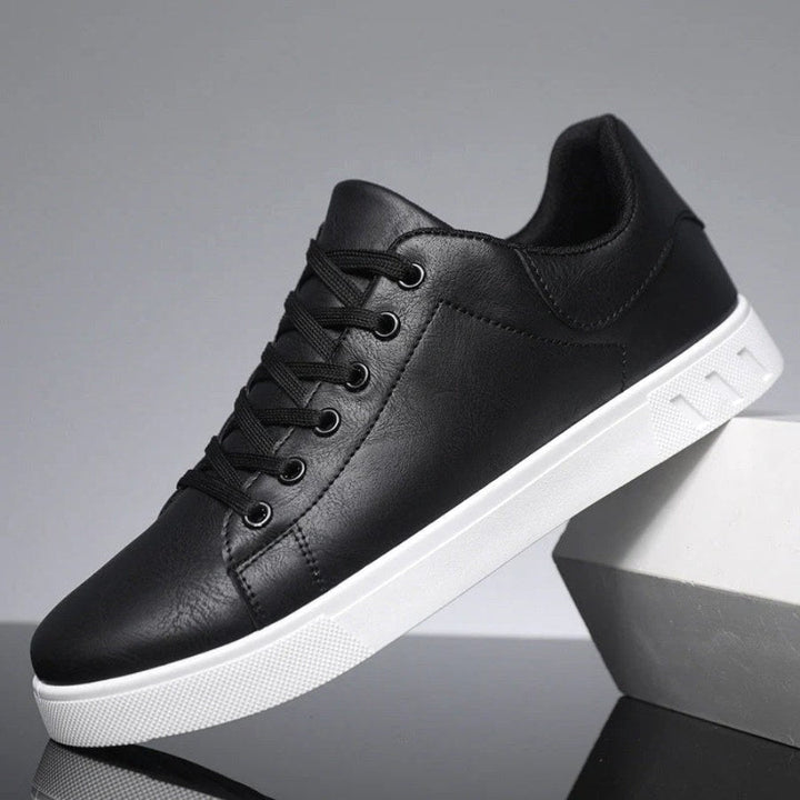 Black smart casual men's trainers, offering versatile style and everyday comfort for modern fashion.