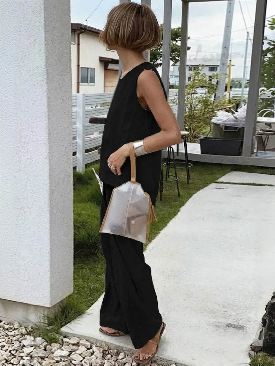 Coordinated women's outfit: sleeveless tank and wide-leg pants set for chic comfort & summer fashion.