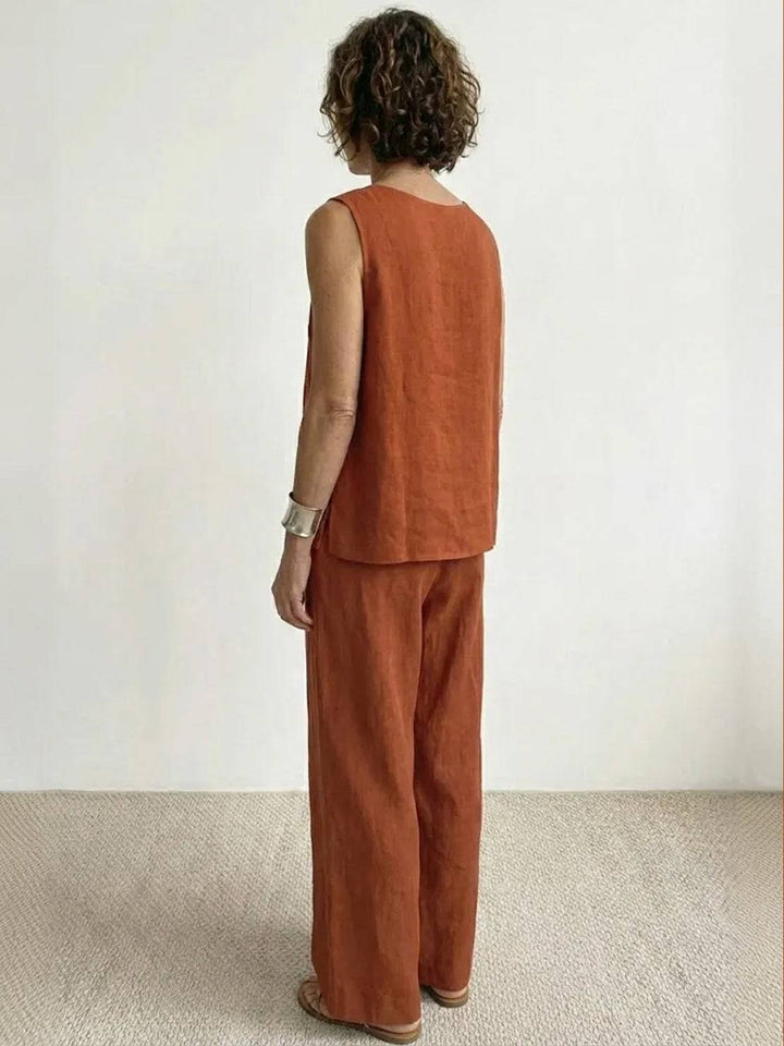 Complete women's outfit: sleeveless tank and wide-leg pants set, designed for comfort & chic everyday wear.