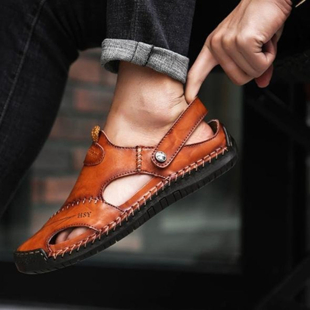 Men's comfortable brown leather fisherman sandals with adjustable straps, perfect for casual summer wear.