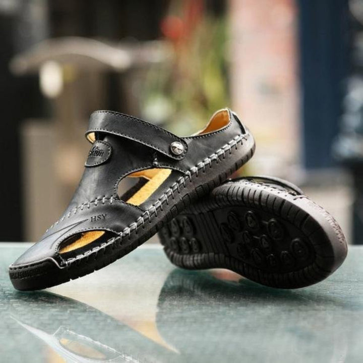 Stylish men's fisherman sandals in a neutral tone, featuring adjustable straps for a secure and comfortable fit, casual fashion.