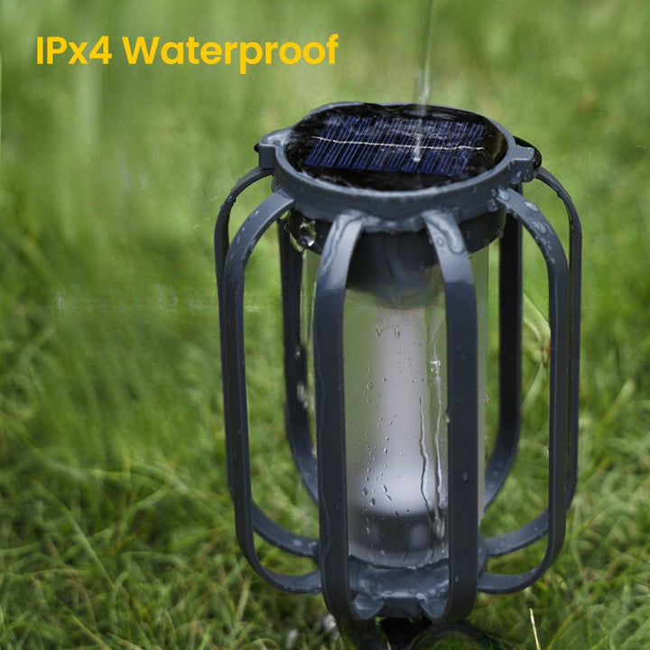Garden lamp LED lantern, weatherproof, solar & USB charged, provides warm flickering light for evening enjoyment.