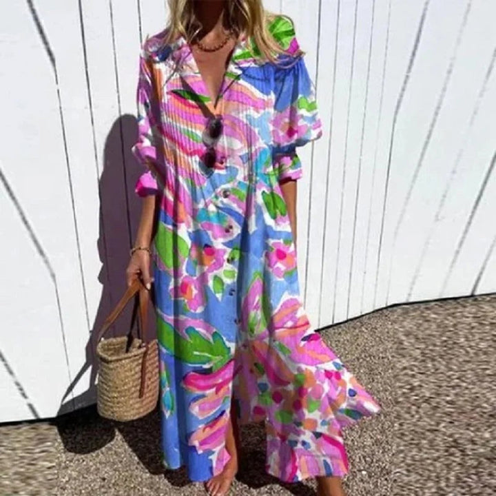 Elegant bohemian maxi dress with vibrant floral print, flowy silhouette, great for summer & resort wear.
