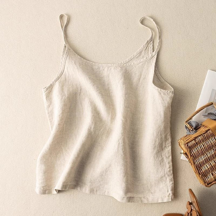 Women's flowy scoop neck camisole top with spaghetti straps, perfect for summer layering and comfort.