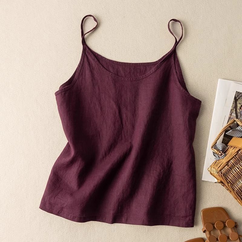 Stylish women's flowy camisole top featuring a flattering scoop neck and delicate spaghetti straps.