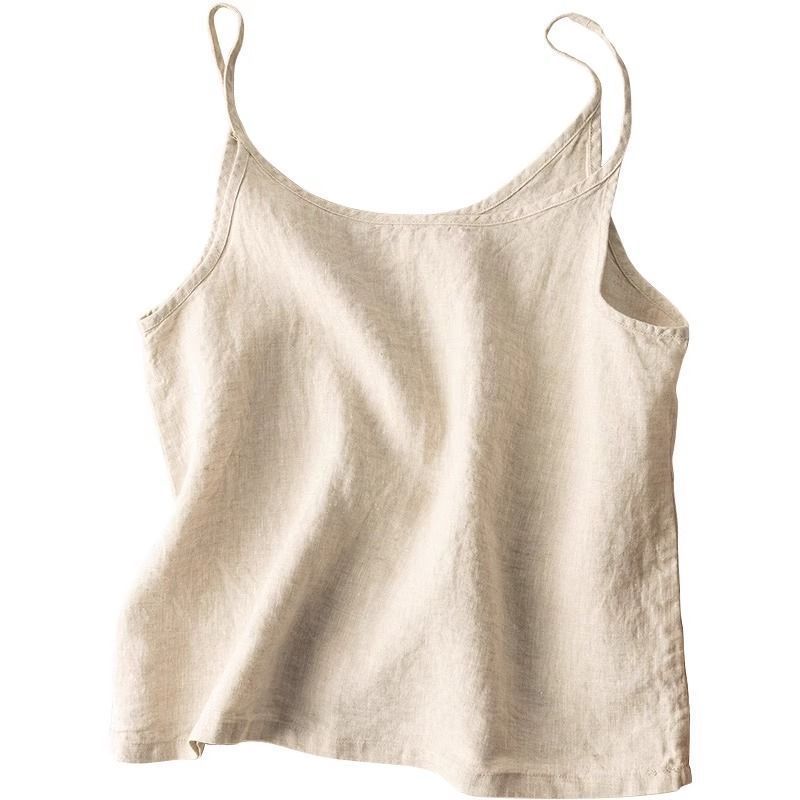Model wearing a chic flowy scoop neck camisole top, styled for a relaxed and casual summer look.