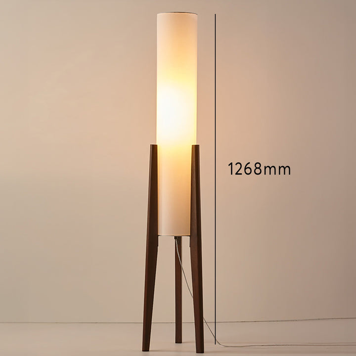 Natural wood floor lamp with a clean, minimalist design and a soft fabric shade, a perfect Scandinavian accent.