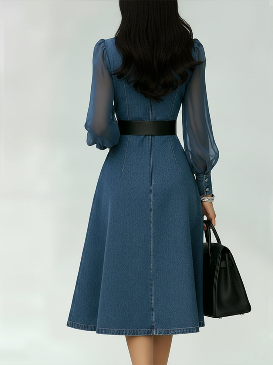 Sophisticated women's denim A-line dress featuring a belt & sheer long sleeves, ideal for work or party.